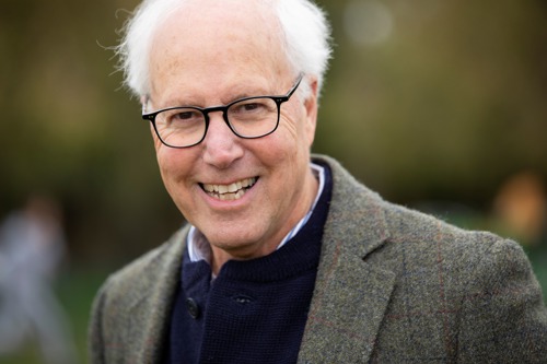 man with short grey hair and glasses