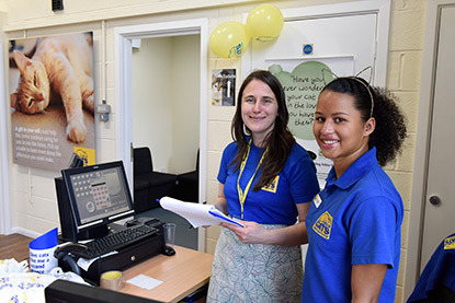 Two female Cats Protection staff at reception desk