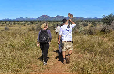 woman and man walking in the Na'ankuse conservation project