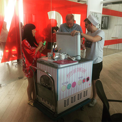 people gathered around ice cream cart