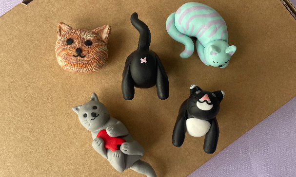 Collection of cat shaped clay magnets